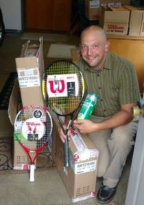 Sandusky Recreation Director, Jason Werling, with new tennis racquets and balls given by Al's Clinics! Come to see the next organization we IMPACT!!