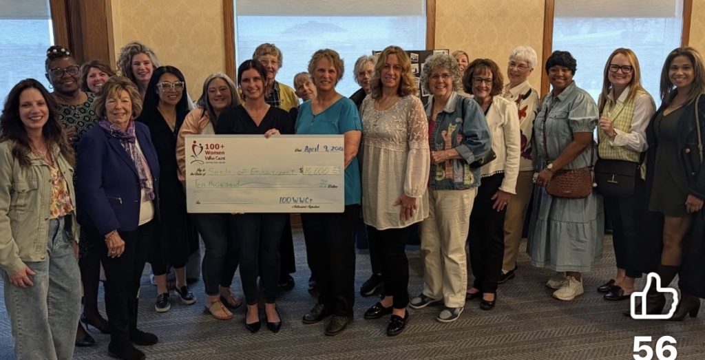 100Women reps awarding CASA the total donation of $16,550.00.