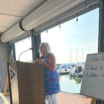 Vicki Fitzpatrick passionately presenting Fathers Heart Food Pantry at 100 WWC July 2025 meeting.