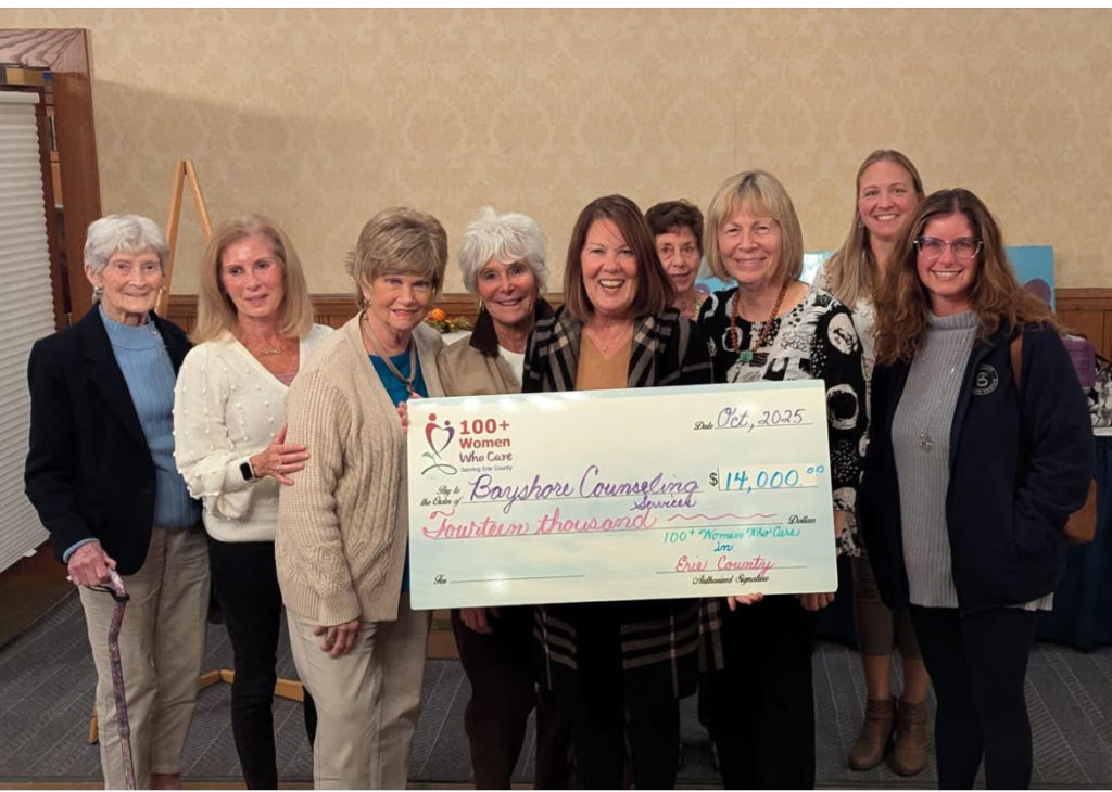 Members of 100 Women at SYC Oct 2025 meeting pictured with Bayshore Counseling Services presenter, Connie Frisch