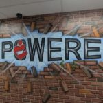 ‘Empowering’ graphic at entrance to CACEHR