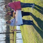 Laura accepting a check at the farm.