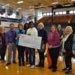 SCAASP volunteers and members from 100 Women Who Care with Roz at school assembly 3/6/18.