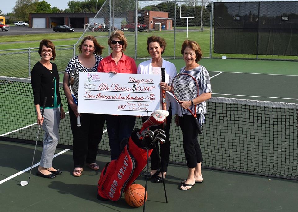 100+ Women Who Care in Erie Co presenting $10,200 to Lori Schlessman for Al's Clinic 5/17